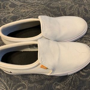 Brand new Nike slip ons size 7. In white.